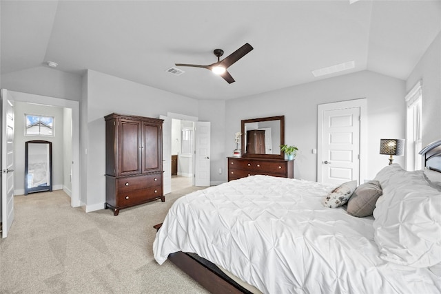 bedroom featuring ceiling fan, light colored carpet, and lofted ceiling