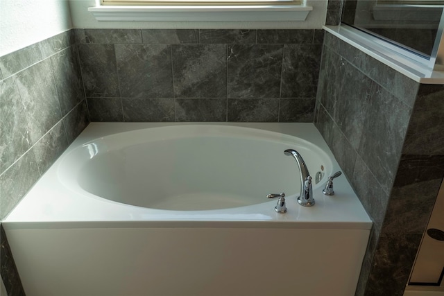 bathroom with a washtub