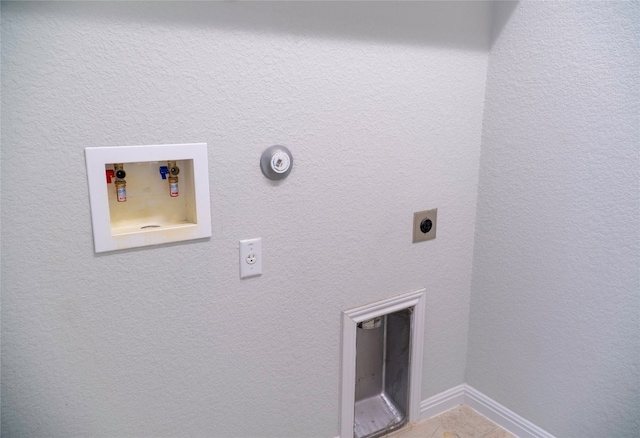 clothes washing area with hookup for an electric dryer and hookup for a washing machine