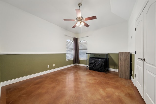 unfurnished living room with lofted ceiling and ceiling fan