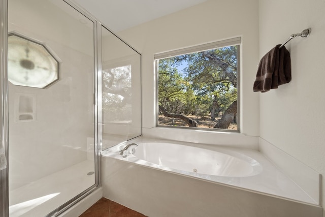 bathroom featuring shower with separate bathtub and tile patterned floors