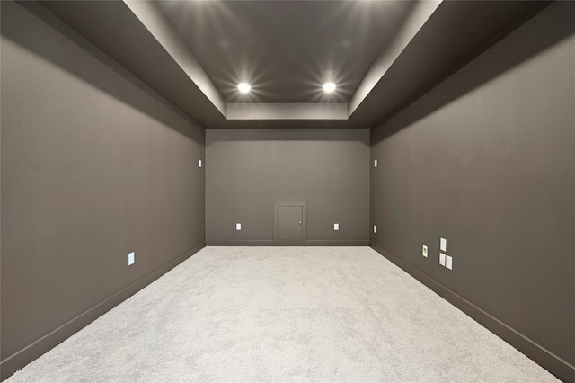 7701 Becasseau Dr, Austin, TX 78738 - carpeted empty room with a tray ceiling and recessed lighting