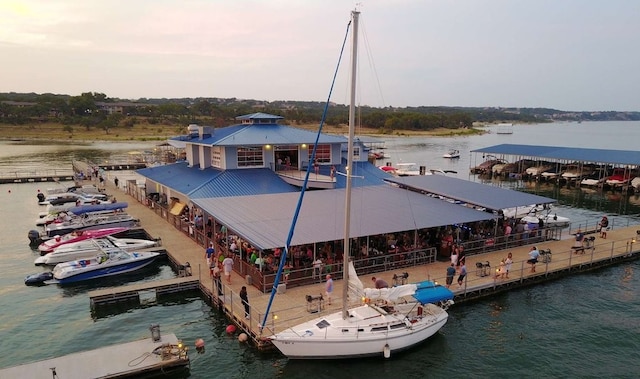 view of dock featuring a gazebo and a water view