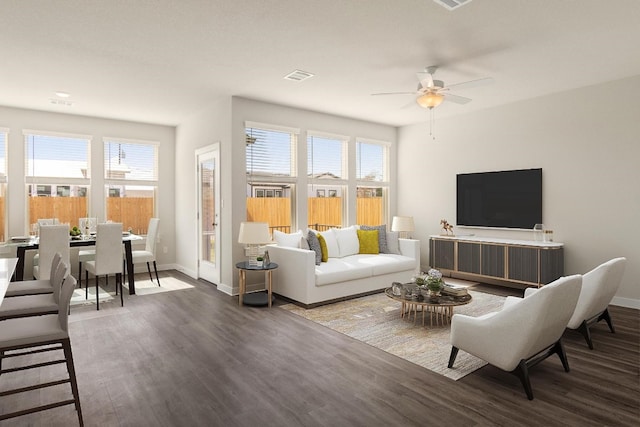 living room featuring ceiling fan and dark hardwood / wood-style floors