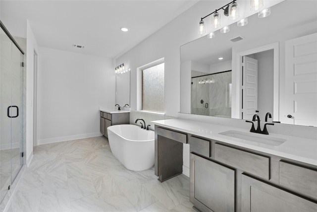 bathroom featuring vanity and separate shower and tub