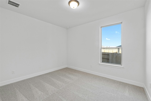 unfurnished room featuring carpet