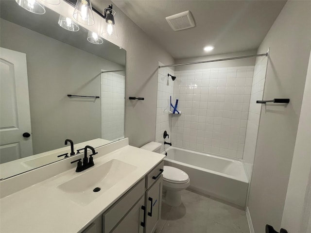 full bathroom with tile patterned floors, toilet, vanity, and tiled shower / bath