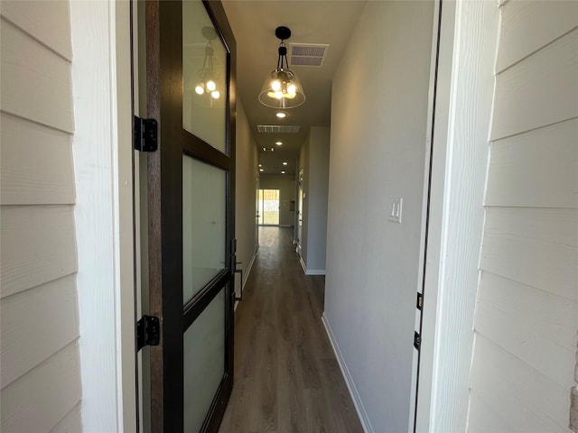 hall with dark hardwood / wood-style flooring