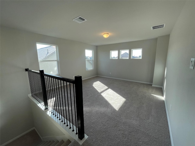 unfurnished room with carpet floors