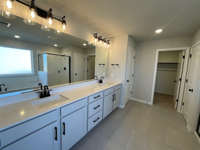 bathroom featuring vanity, tile patterned floors, and an enclosed shower