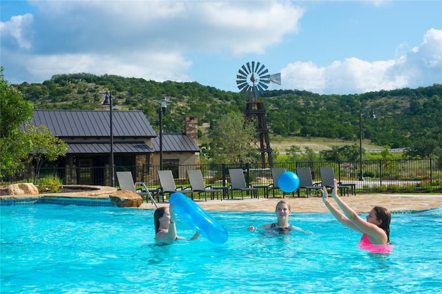 view of swimming pool featuring a water slide