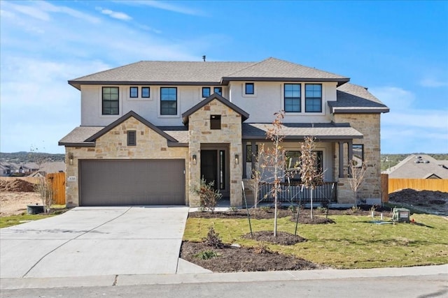 view of front of home with a garage and a front yard