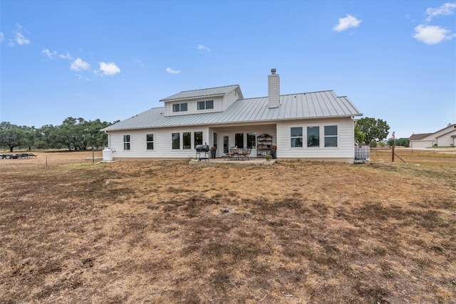 back of property featuring a patio