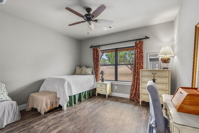 bedroom with dark wood-type flooring and ceiling fan