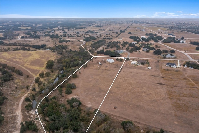 birds eye view of property featuring a rural view