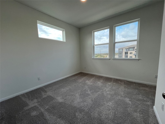 carpeted empty room with a wealth of natural light