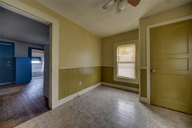 207 S Waco St, Giddings, TX 78942 - empty room with ceiling fan and baseboards