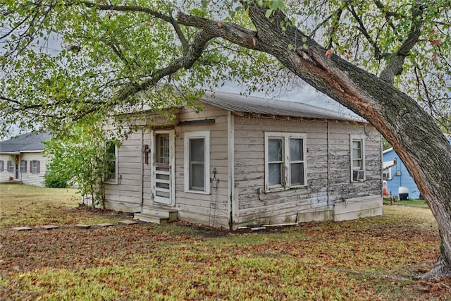 view of side of property with cooling unit