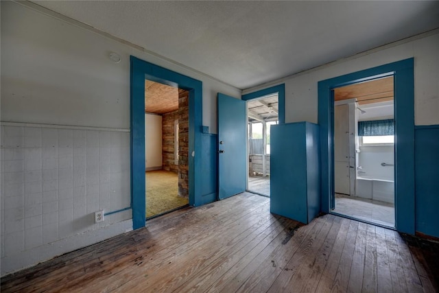 207 S Waco St, Giddings, TX 78942 - spare room with hardwood / wood-style flooring