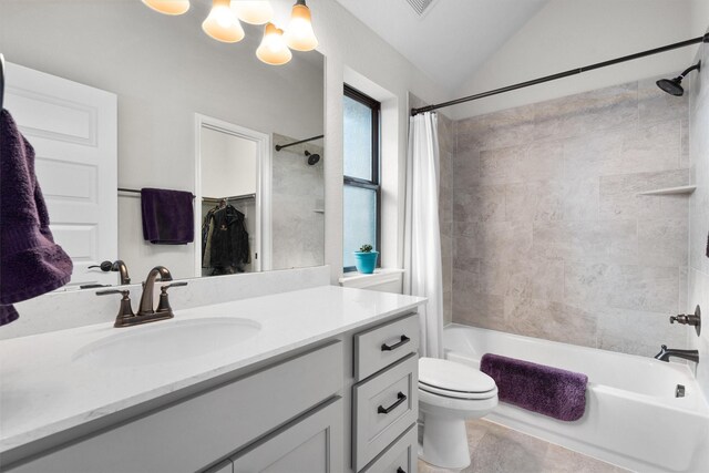 full bathroom featuring shower / bath combo, tile patterned flooring, vaulted ceiling, toilet, and vanity