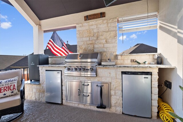 view of patio featuring grilling area and an outdoor kitchen