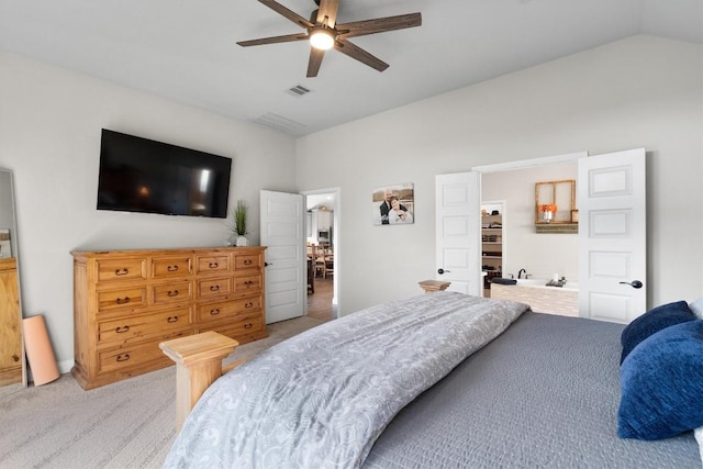 carpeted bedroom with ceiling fan and lofted ceiling