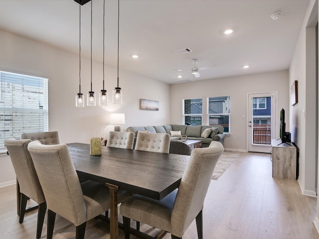 dining space featuring ceiling fan and light hardwood / wood-style flooring