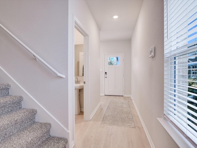 doorway to outside featuring light hardwood / wood-style floors