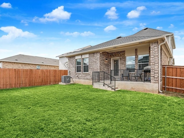 193 Standing Rock Ln, Marble Falls, TX 78654 - back of house featuring brick siding, cooling unit, and roof with shingles
