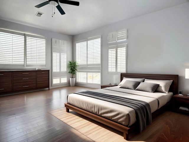 bedroom featuring dark wood-type flooring and ceiling fan