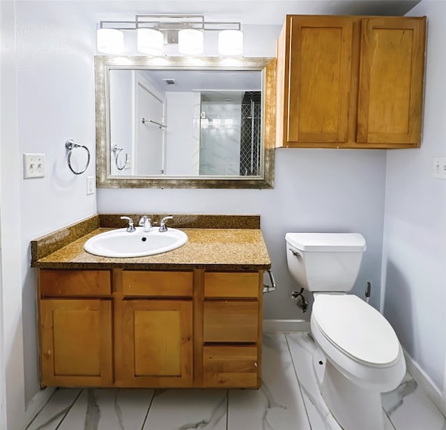 bathroom featuring toilet, vanity, and walk in shower