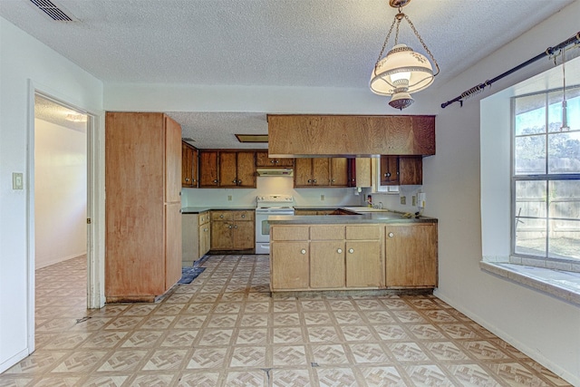 kitchen with white range with electric stovetop, pendant lighting, a wealth of natural light, and a textured ceiling