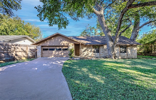 single story home with a garage and a front yard