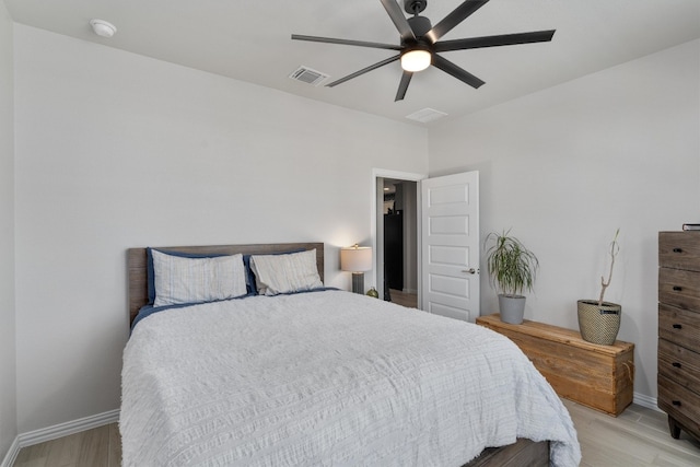 bedroom featuring light wood-type flooring and ceiling fan