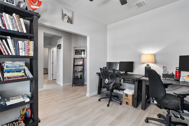 office space featuring ceiling fan and light hardwood / wood-style flooring