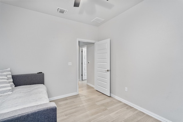 sitting room featuring light wood-type flooring and ceiling fan