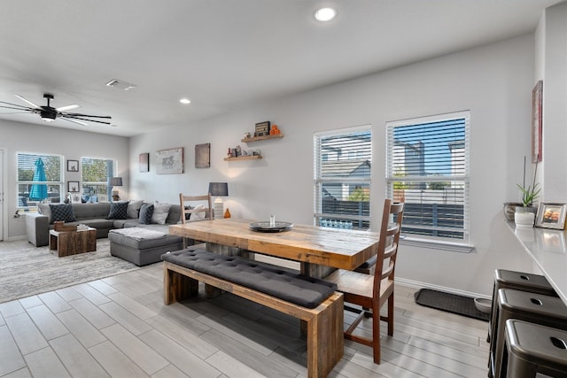 dining area featuring light hardwood / wood-style floors and ceiling fan