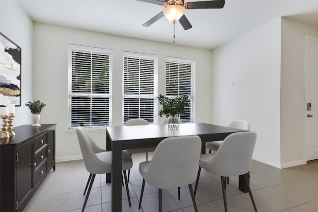 tiled dining area featuring ceiling fan