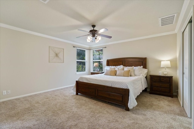 bedroom with light carpet, ceiling fan, and crown molding