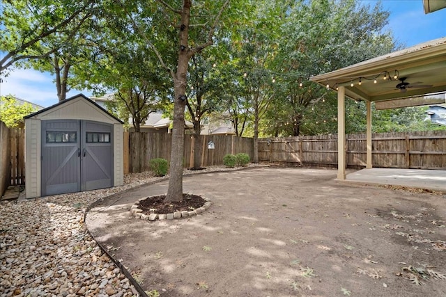 view of patio featuring ceiling fan and a storage shed