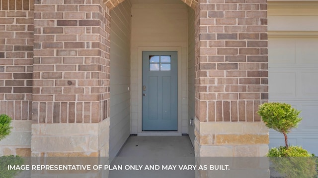 entrance to property featuring a garage