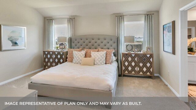 bedroom featuring vaulted ceiling and light colored carpet