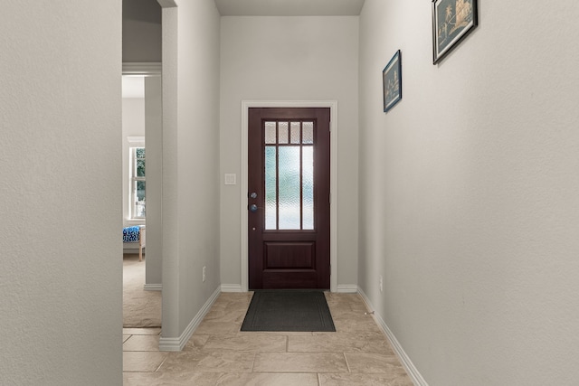 foyer with light tile patterned flooring