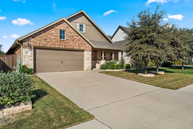 view of front of house featuring a garage and a front lawn