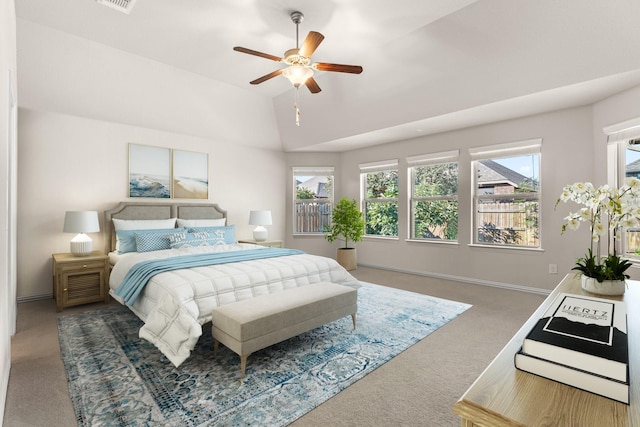 carpeted bedroom featuring ceiling fan and lofted ceiling