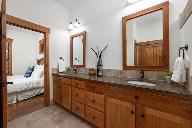 bathroom with hardwood / wood-style flooring and vanity