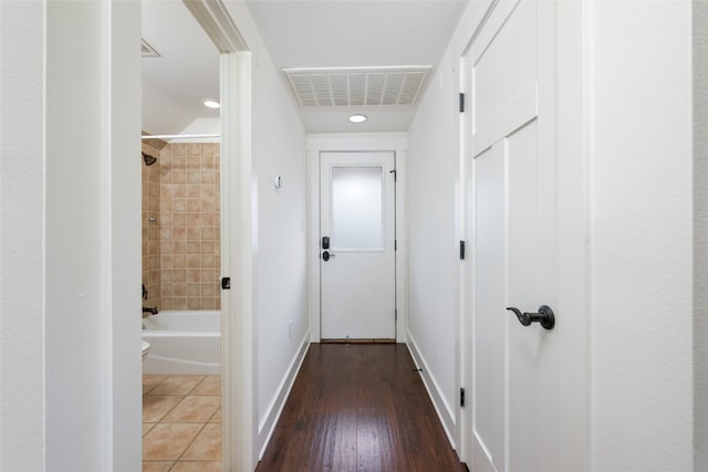 hallway with dark hardwood / wood-style floors