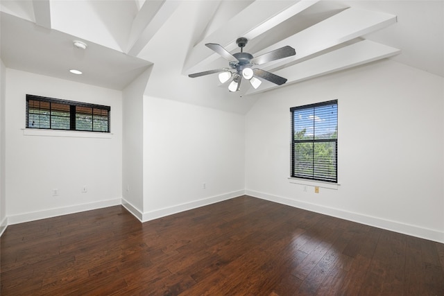 unfurnished room featuring ceiling fan, dark hardwood / wood-style floors, and lofted ceiling with beams