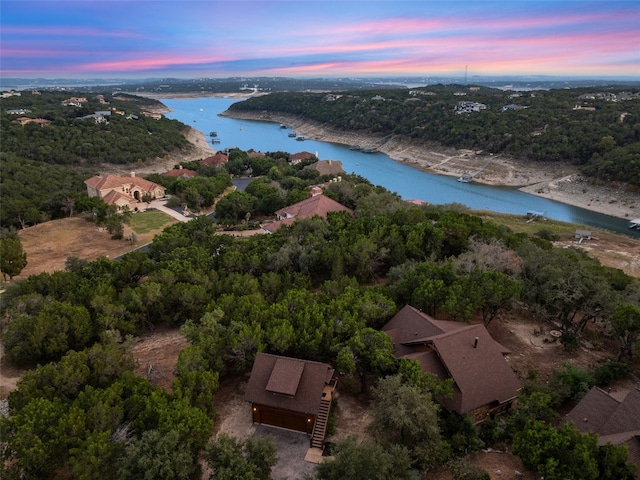 aerial view at dusk with a water view