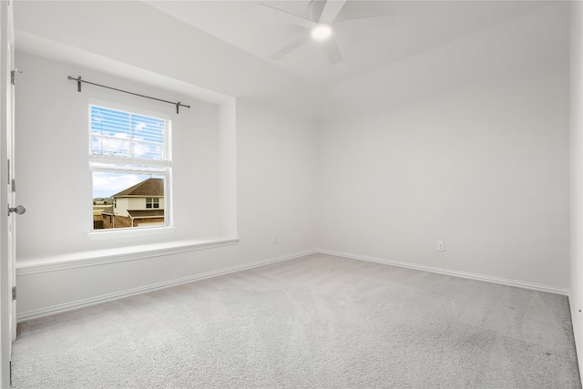 spare room with carpet floors and ceiling fan